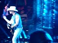 Kenny Chesney trying to play guitar & walk w/hurt foot