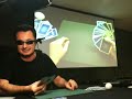 Augmented Reality (AR) magician Marco Tempest performs an amazing AR magic routine with real cards at the augmented reality meetup in NY (ARNY) on March 16th. Don't miss the disapearing card trick at 2:30. A special explanation of how it's done is delivered by Marco towards the end. Watch a better capture of the screen flow at www.youtube.com For on-going live streams and recordings of meetup events check out armeetup.org