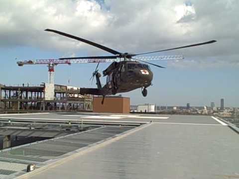 helipad - With a roar, the Blackhawk helicopter approached the helipad and deftly maneuvered between antennas and a construction crane to alight atop the new hospital ...