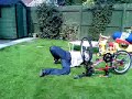 Jackass stunt(jump balls 1st onto spinning bike tire)