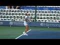warming up before her match