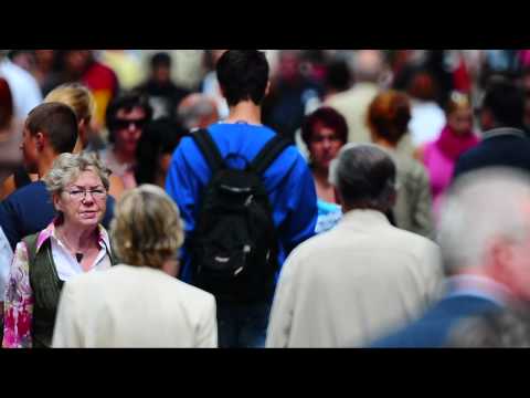 crowd - The mass of the people on the street walking. F1000mm. HD Video.