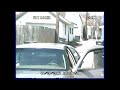 Crook breaking into neighbors car