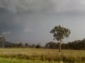 At this stage (approx 1:30pm) this first supercell of the afternoon really began to take shape.  Inflow was already extreme with piles of dust being drawn into the rapidly developing storm.  Driving was becoming dangerous with branches, small pieces of debris all part of the inflow feed.This particular storm was reported to have produced a tornado at Womblepong which was near where this video was filmed.This storm would go on to produce winds near 130km/h and cause significant damage.