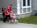 abigail riding her bike with no training wheels
