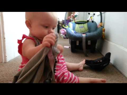 Vivi playing with a balloon and doing her best peek-a-boo