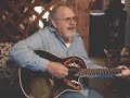 Danny Cohran playing and singing