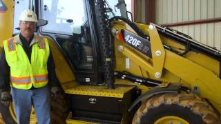 Learn the location of your Cat® backhoe loader's remote jump start lugs.