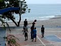 By the sea, on isolated roadside small town of La Ciénaga (pop. 7,715) in Barahona, SouthWest region of the Dominican Republic. No fancy sneakers or uniform required to play here. Actually, most play