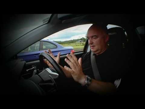 Video: Mitsubishi EVO 10 vs BMW 135i Coupe Photo Video: Mitsubishi EVO 10 vs BMW 135i Coupe