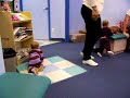 Two babies kiss at doctors office
