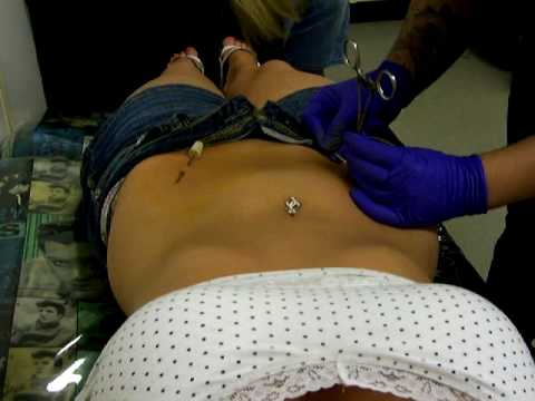 my hip piercing. me getting my hips pierced!