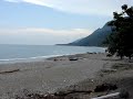 By the sea, on isolated roadside small town of La Ciénaga (pop. 7,715) in Barahona, SouthWest region of the Dominican Republic. No fancy sneakers or uniform required to play here. Actually, most play