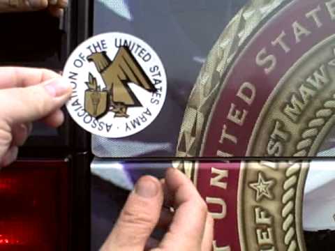 CSM (Ret) Herb Schmeling putting AUSA sticker on CoinForce.com H2 Hummer