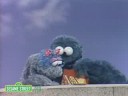Sesame Street: Ernie With Cookie Monster's Baby Cousin