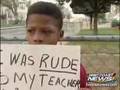 Mom Makes Misbehaving Son Apologize with Sign on Street Corn