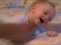 Baby giggles when tickled by beanie baby Baby giggles when tickled by beanie baby
