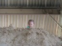 Mason climbing on clay hill in stills