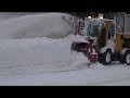 snow removal operation of sidewalk in a city