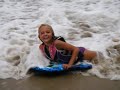 Kayla riding the waves