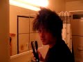Straightening his hair