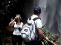 Guests - Samantha and Roderik walk under Purlingbrook Falls after a big wet.
