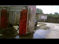 A black car using a automatic car wash A black car using a automatic car wash