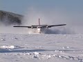 Twin Otter landing frozen lake with wheel-skis Twin Otter landing frozen lake with wheel-skis