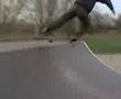 me skateboarding doing a fakie pop heel flip rock