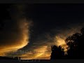 V02577 Stringy stratus backlit at sunset timelapse