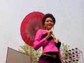 Songkran - Contest of Ladies Riding Bicycles with Umbrellas