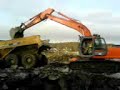 A Gps excavator Hitatchi loading Dumper