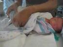 Holding Thomas