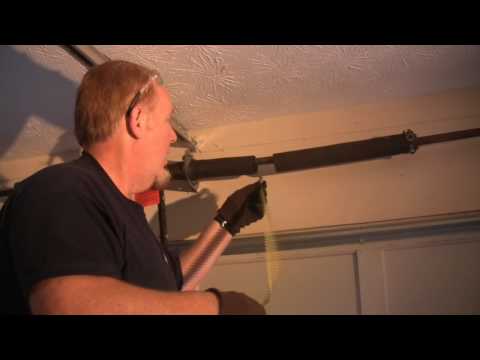 how to repair the spring on a garage door