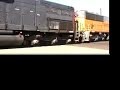 visit http://homepage.mac.com/railfanjunction/railfanjunction.html for more great videos and photos.  this is a shot of up emd sd40t-2 and an early three piece windshield sd60m pulling a cut of cars down south 9th st. in colton, ca.  in the background is a very rare ex- pacific electric wig wag signal protecting the crossing at m street.