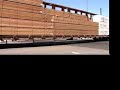 visit http://homepage.mac.com/railfanjunction/railfanjunction.html for more great videos and photos.  this is a shot of up emd sd40t-2 and an early three piece windshield sd60m pulling a cut of cars down south 9th st. in colton, ca.  in the background is a very rare ex- pacific electric wig wag signal protecting the crossing at m street.