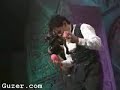 A guy playing piano with his balls.