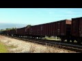 LLPX 2294 AND MP15AC Y1447 LEAD A 73 GONDOLA CAR SAND TRAIN UP THE WEST ALLIS HILL WITH THE AID OF THE Z TRAIN PUSHING IT FROM BEHIND 6 11 09