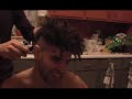 Liron Peled shaving his dreadlocks