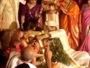 in south india this is called muhurtham (the groom tying the thali around the neck of the bride). it is at this moment when they are declared officially and religiously as husband and wife. this moment may be compared to the exchange of wedding rings in western weddings.