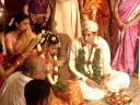 in south india this is called muhurtham (the groom tying the thali around the neck of the bride). it is at this moment when they are declared officially and religiously as husband and wife. this moment may be compared to the exchange of wedding rings in western weddings.