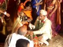 in south india this is called muhurtham (the groom tying the thali around the neck of the bride). it is at this moment when they are declared officially and religiously as husband and wife. this moment may be compared to the exchange of wedding rings in western weddings.