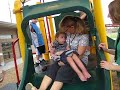 Sliding with his teacher!