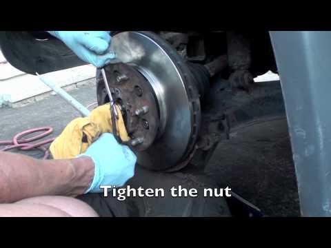 Nissan Xterra front brake rotor caliper removal and replacement.