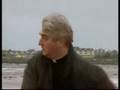 Father Ted contemplating on the beach