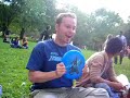 Benny dancing with a frisbee on his head