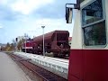 Schmalspurgüterzug überholt triebwagen