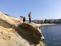 matthew, anton, and tom tackle low tide 40 foot camp cove. edan lasker filming.