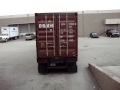 gp auto corp. auto glass 40 feet container receiving process and positioning at the warehouse dock level, for easily forklift access and auto glass pallet handling.