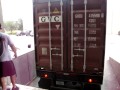 gp auto corp. auto glass 40 feet container receiving process and positioning at the warehouse dock level, for easily forklift access and auto glass pallet handling.